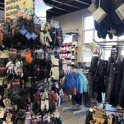 Ski glove racks in-store showing our huge selection of ski gloves and mittens we offer from brands like POW, Hestra, Salomon, and more!