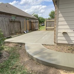 SM Precision Concrete Solutions - Concrete patio with sidewalk.