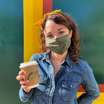 Neighbors Coffee - a woman wearing a face mask and holding a cup of coffee - Coffee & Tea Near Me - Los Olivos, California Neighbors Coffee - a woman wearing a face mask and holding a cup of coffee - Coffee & Tea Near Me - Los Olivos, California