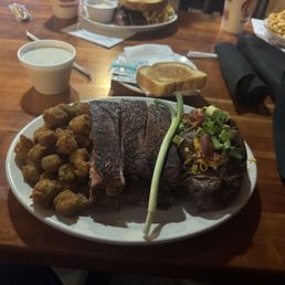 Half rack of ribs (2 meat plate) loaded baked potato and fried okra Half rack of ribs (2 meat plate) loaded baked potato and fried okra