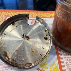 Vn Pho - Lid on top of paste with water in it, stored in the non-refrigerated condiments on the table.