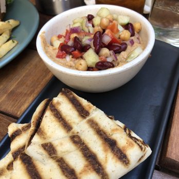 Raleigh's Pub - Hummus and chips.... still trying to figure out where the chips are. - American Near Me - Berkeley, California