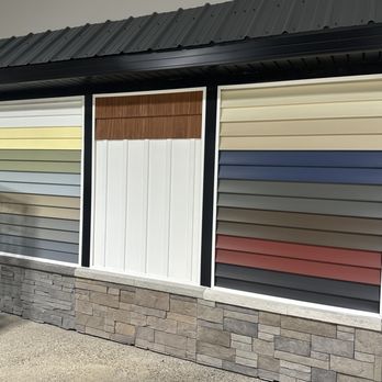 Dover and Company- Garage & Entry Doors - Some displays of different siding options we offer. - Garage Door Services Near Me - Flint, Michigan