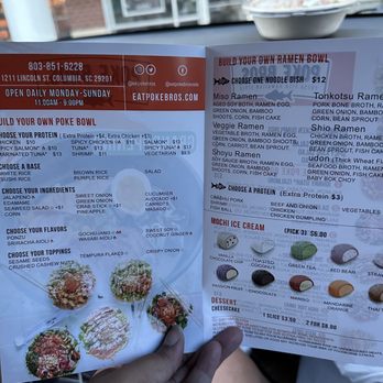 Poke Bros - a person holding a menu in their hand - Poke Near Me - Midlothian, Virginia