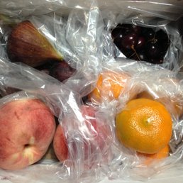 Fresh figs, cherries, white peaches, and tangerines