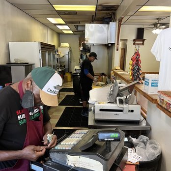 Sub One Hoagie House - a man working at a cash register - Sandwiches Near Me - Charlotte, North Carolina