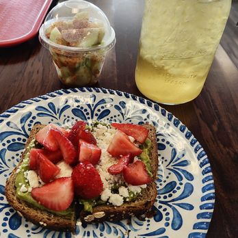 FAVs - Avocado toast with feta cheese and strawberries on top, a small container of peppino's and the delicious lemongrass and mint tea. - Salad Near Me - Amarillo, Texas