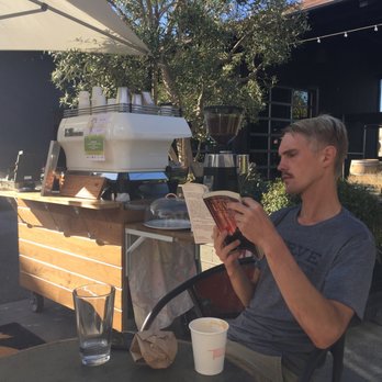 Welcome Coffee Cart - a man reading a book - Coffee & Tea Near Me Welcome Coffee Cart - a man reading a book - Coffee & Tea Near Me