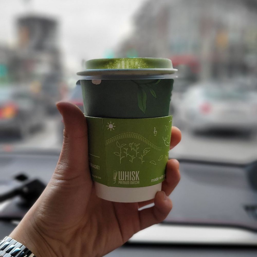 Whisk Matcha - a person holding a cup of coffee - Coffee & Tea Near Me - Vancouver, British Columbia Whisk Matcha - a person holding a cup of coffee - Coffee & Tea Near Me - Vancouver, British Columbia