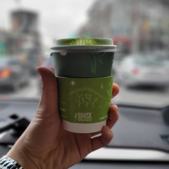 Whisk Matcha - a person holding a cup of coffee - Coffee & Tea Near Me - Vancouver, British Columbia Whisk Matcha - a person holding a cup of coffee - Coffee & Tea Near Me - Vancouver, British Columbia