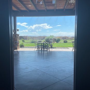 The Fish Rock Grille - a patio with a table and chairs - Seafood Near Me - Saint George, Utah The Fish Rock Grille - a patio with a table and chairs - Seafood Near Me - Saint George, Utah