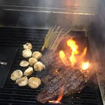 Compass Rose Harbor Bar - a steak being cooked on a grill - Bars Near Me - Frackville, Pennsylvania