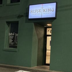 Silver King Games & Hobby - Exterior photo of Silver King in the bank building on the corner, It's in the popular alley way behind the brick bank.