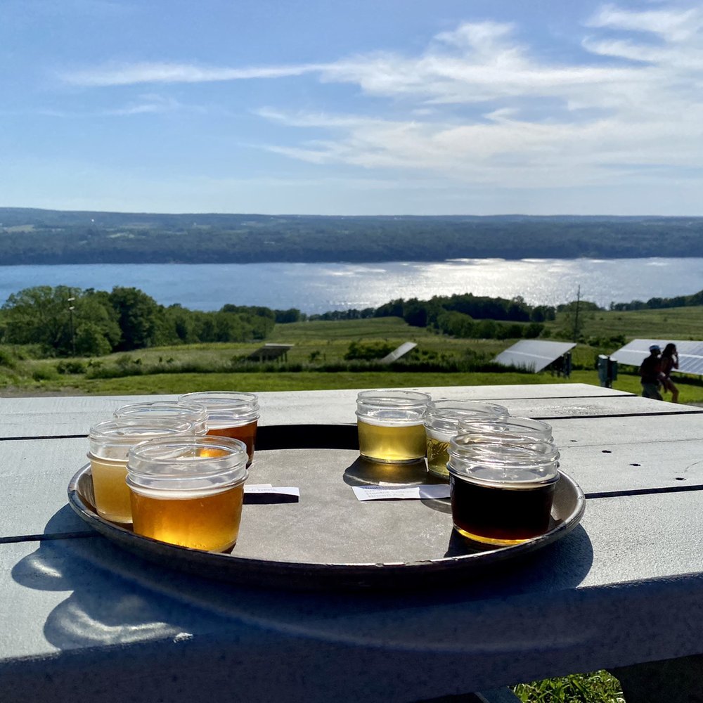 Two Goats Brewing - Our beer flight overlooking the lake - Breweries Near Me - Hector, New York