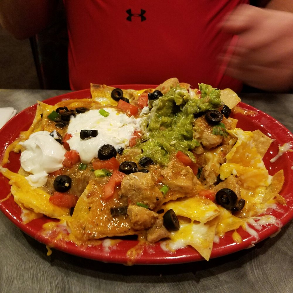 El Sol - a plate of nachos on a table - Mexican Near Me - Logan, Utah El Sol - a plate of nachos on a table - Mexican Near Me - Logan, Utah