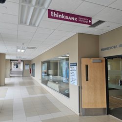 Think Bank - Interior corridor leading to Think Bank, featuring clear directional signage.