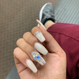 Two weeks and my nails still have all the rhinestones  totally recommend this place