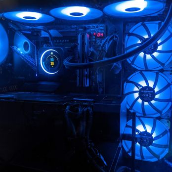 Quigley Technology Services - Finished custom PC build with high performance components, liquid cooling, clean cable management, and blue RGB lighting. - IT Services & Computer Repair Near Me Quigley Technology Services - Finished custom PC build with high performance components, liquid cooling, clean cable management, and blue RGB lighting. - IT Services & Computer Repair Near Me