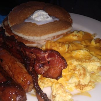 Riverside Grill & Bar - The BASICX Pancakes, bacon, sausage and scrambled eggs with cheese. - Breakfast & Brunch Near Me - Chino, California Riverside Grill & Bar - The BASICX Pancakes, bacon, sausage and scrambled eggs with cheese. - Breakfast & Brunch Near Me - Chino, California