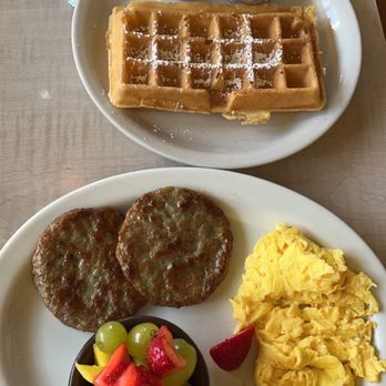 The Waffle - The Waffle Breakfast with Scrambled Eggs, Fruit, Waffle, and House Sausage| IG: @socalsnomnoms - New American Near Me - Los Angeles, California