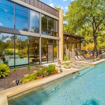Lodgewell - The Haven backyard includes a spectacular lap pool, loungers, 3 fire pits, grill, screened porch, and unobstructed views of the landscape. - Vacation Rentals Near Me - Austin, Texas Lodgewell - The Haven backyard includes a spectacular lap pool, loungers, 3 fire pits, grill, screened porch, and unobstructed views of the landscape. - Vacation Rentals Near Me - Austin, Texas