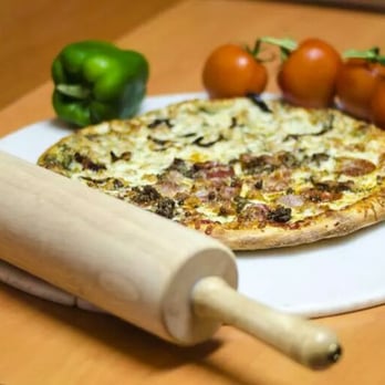Pizza Pienza - a rolling pin, cheese, and tomatoes - Pizza Near Me - Oakville, Ontario Pizza Pienza - a rolling pin, cheese, and tomatoes - Pizza Near Me - Oakville, Ontario