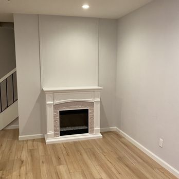 Green Construction Builders - Updated fireplace and floor - Landscaping Near Me
