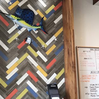 Sushi Man - a fish on the wall of a restaurant - Sushi Bars Near Me - Champaign, Illinois