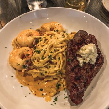 Twisted Tavern - Chef's Special on 05.28.21: 10oz strip steak with three prawns on top of linguini pasta in a tomato/wine/cream sauce ($55.00) - American Near Me - Arnold, Missouri Twisted Tavern - Chef's Special on 05.28.21: 10oz strip steak with three prawns on top of linguini pasta in a tomato/wine/cream sauce ($55.00) - American Near Me - Arnold, Missouri