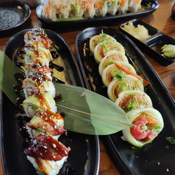 Hooked On Sushi - Black dragon roll (left), sashimi roll (right), orange crush (in back) - Japanese Near Me - Encinitas, California Hooked On Sushi - Black dragon roll (left), sashimi roll (right), orange crush (in back) - Japanese Near Me - Encinitas, California