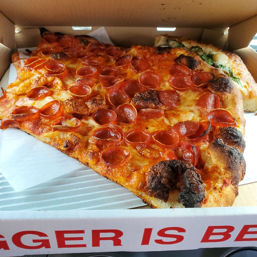 Big Mario’s Pizza - 2 of the 4 slices - Pizza Near Me - Seattle, Washington Big Mario’s Pizza - 2 of the 4 slices - Pizza Near Me - Seattle, Washington
