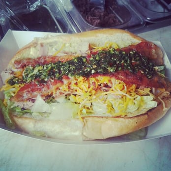 Croutons Catering - The "Matador"- pork, ham, bacon, cheddar, lettuce, chimichurri, toasted bolillo roll - Caterers Near Me Croutons Catering - The "Matador"- pork, ham, bacon, cheddar, lettuce, chimichurri, toasted bolillo roll - Caterers Near Me