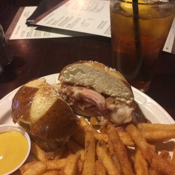 The Pub - Ham & swiss on pretzel bun with beer-braised onions and a mustard with kick! - Pubs Near Me - Cleveland, Ohio