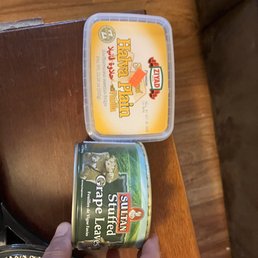 a person holding a can of canned food a person holding a can of canned food