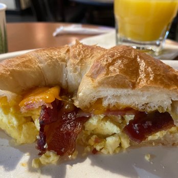 Sports Page Pub - Egg bacon cheddar croissant. Not bad for a pit stop meal before a flight. - Sports Bars Near Me - Seattle, Washington