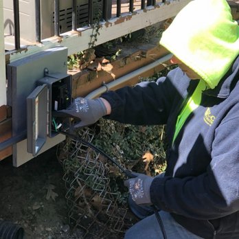 K-CO Electric - A K-CO Electric technician installing an outdoor electrical disconnect for an hot tub system at a residential property. - Electricians Near Me - Plainville, Connecticut