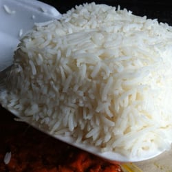 Precariously packaged rice... protective helmet advised