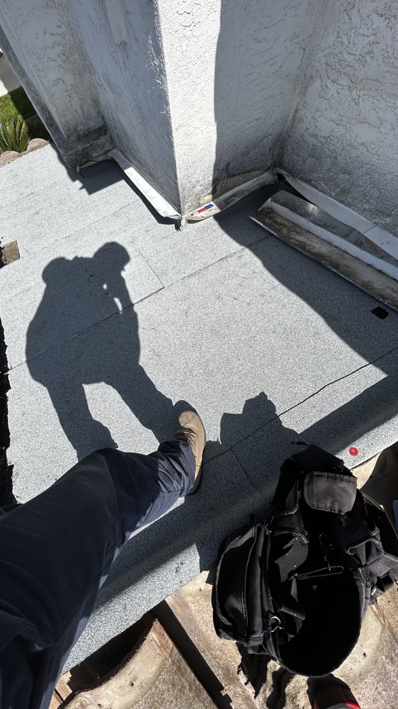 Slide of J&E Roofing Services