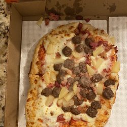 Little Caesars Pizza - What my "deep dish " looked like. It looks like a personalized pizza. Not even rectangular. Undercooked