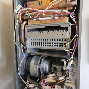 Zebs Plumbing - Inside a tankless during repair - Plumbing Near Me - Apple Valley, California Zebs Plumbing - Inside a tankless during repair - Plumbing Near Me - Apple Valley, California