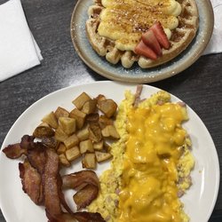 Rincon Del Viajero - Waffle Platter  Scrambled eggs with jam and cheese, waffle with catalana cream, bacon and potatoes