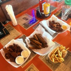 Four Leaf On Main - Sweet potato waffle fries, fried pickle spears, fries, spicy cheese bites