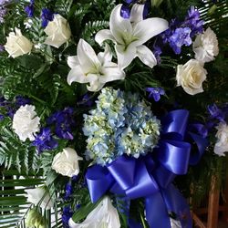 New Port Richey Florist - blue and white sympathy spray. 727 849 2222