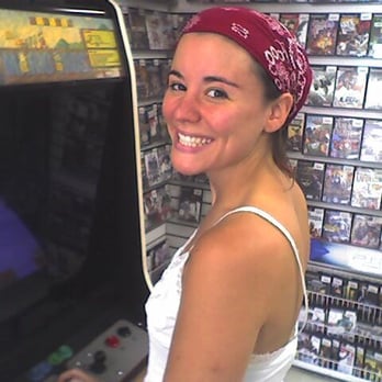 Gameplay - A happy Game Play customer enjoys their Super Mario Brothers stand-up arcade game. - Toy Stores Near Me - Los Angeles, California