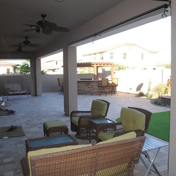 Alrey's Landscaping - a patio with wicker furniture - Landscaping Near Me