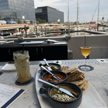 Ouzo Beach - Spreads (feta, eggplant, tzatziki) with warm pita - Bars Near Me - Baltimore, Maryland