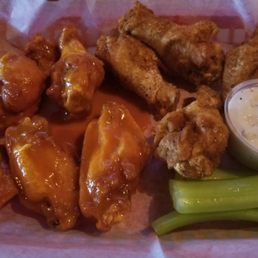 Cajun on right, gold BBQ on left (with a little hot mixed in for a bite). Great wings in hidden bar food gem. Cajun on right, gold BBQ on left (with a little hot mixed in for a bite). Great wings in hidden bar food gem.