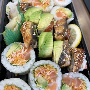 Sushiyo - a variety of sushi rolls in a plastic container - Korean Near Me - Montreal, Quebec