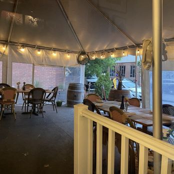 Omar's Carriage House - part of the back patio- it's covered entirely and a large area - New American Near Me - Norfolk, Virginia
