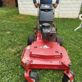 Vazquez Landscaping & Tree Services - a man standing next to a lawn mower - Landscaping Near Me Vazquez Landscaping & Tree Services - a man standing next to a lawn mower - Landscaping Near Me